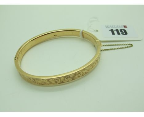 A Hinged Bangle, leaf scroll engraved to the front, to snap clasp, indistinctly stamped "15ct" (11grams).Lot 119 - Surface sc