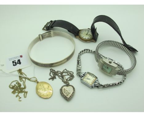 A 9ct Gold Oval Locket Pendant, on a chain, together with a heart shape locket pendant, a hallmarked silver expanding bangle,