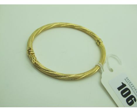 A Modern Hinged Bangle, of textured finish (sprung hinge) stamped "375" (4.7grams). 