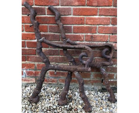 A PAIR OF CAST IRON BENCH ENDSnaturalistically formed as branches, approximately 60cm deep x 88cm high together with two furt