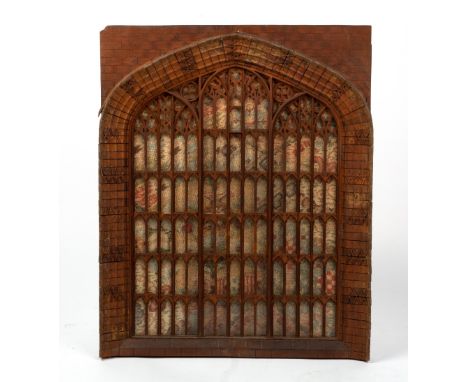 AN OLD CARVED WOODEN MODEL OF A GOTHIC TRACERIED STAINED GLASS WINDOW 44cm wide x 55cm high Condition: some slight losses to 