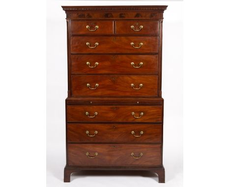 A GEORGE III MAHOGANY CHEST ON CHEST with dentil cornice above two short and six long drawers, the upper section with fluted 