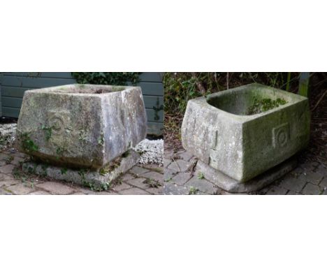 A PAIR OF LARGE ART NOUVEAU CARVED LIMESTONE PLANTERS with square and circle motifs to each side, the planters of rectangular