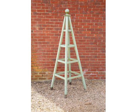A GREEN PAINTED PINE GARDEN PYRAMIDwith ball finial, 66cm square at the base x standing 198cm highAt present, there is no con