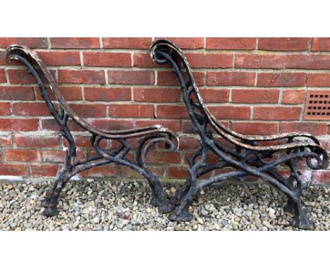 TWO PAIRS OF OLD CAST IRON BENCH ENDSfor scrolling seats and on naturalistically formed 'branch bases', each approximately 72