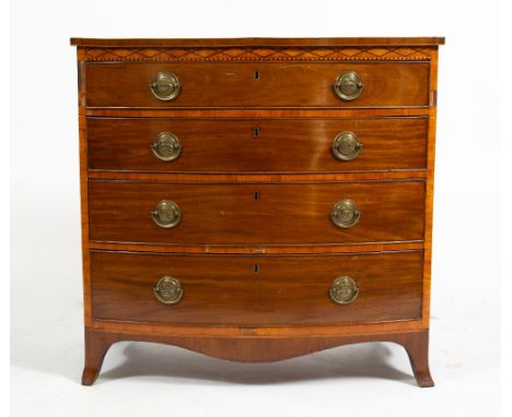 A GEORGE III MAHOGANY AND SATINWOOD CROSS BANDED BOW FRONT CHEST OF FOUR LONG DRAWERS with brass handles and splayed bracket 