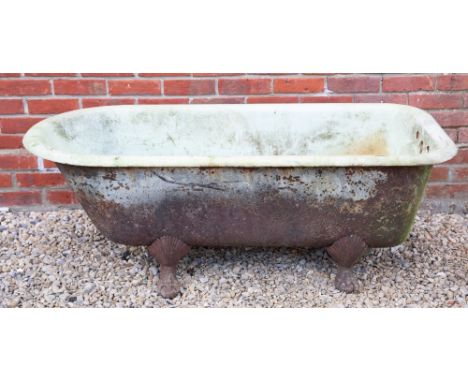 AN ANTIQUE ENAMELLED CAST IRON BATH 148cm in length x 66cm deep x 53cm high Condition: some surface marks and scratches to th