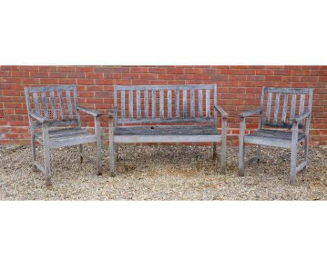 A TEAK GARDEN BENCHtogether with a pair of matching armchairs, the bench 122cm wide x 89cm highCondition: in used condition, 
