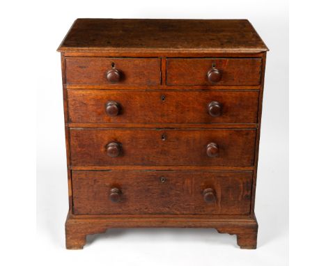 AN 18TH CENTURY CHEST OF TWO SHORT AND THREE LONG DRAWERS with later turned handles and raised on bracket feet, 82cm wide x 5