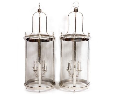 A PAIR OF SILVERED CYLINDRICAL LANTERNS with four branch lamp holders suspended within, 33cm diameter x 88cm high (2) Conditi