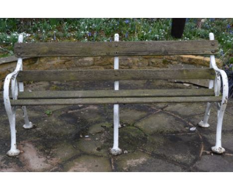 A WHITE PAINTED CAST IRON BENCH with wooden slats, 166cm wide x 83cm high Condition: Weathered, loss to the paint. 