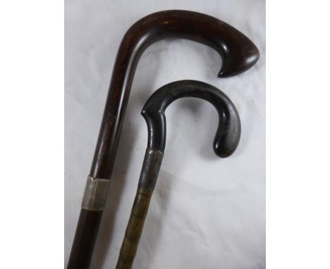 WALKING STICK WITH A SILVER COLLAR AND A SIMILAR PARASOL HANDLE