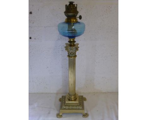 BRASS CORINTHIAN COLUMN TABLE OIL LAMP WITH BLUE GLASS FONT, APPROX. 60 cm