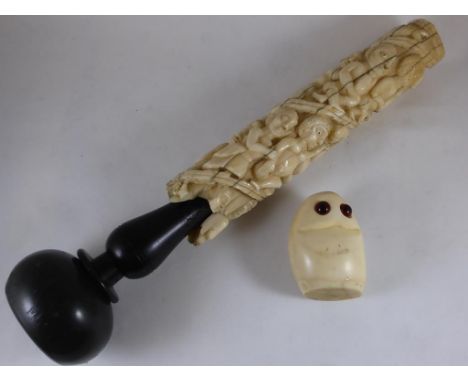 SECTION OF IVORY TUSK APPROX. 18 cm INTRICATELY CARVED WITH FIGURES ON A TURNED WOODEN STAND TOGETHER WITH A STYLISED SEAL FI