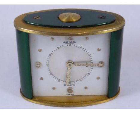 JAEGER GREEN AND GILT METAL OVAL TRAVELLING 8 DAY ALARM CLOCK, APPROX. 6 cm