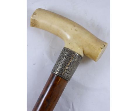 IVORY HANDLED MALACCA WALKING STICK HAVING PROFUSELY ENGRAVED SILVER COLLAR