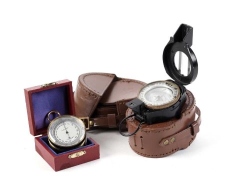 A compass, in leather case with cased strap; and an unsigned pocket compensation barometer in fitted case. (2)