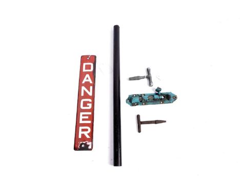 A collection of railwayana, to include: a red enamel 'DANGER' sign 30.5cm long; lignum vitae rule; two carriage keys; and a t
