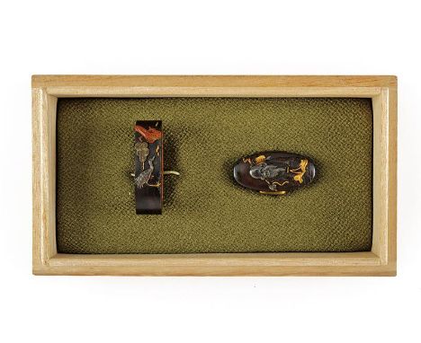 dating: Period (1603-1867) provenance: Japan, The two elements worked en suite in shakudo. The fuchi with a crane in relief b