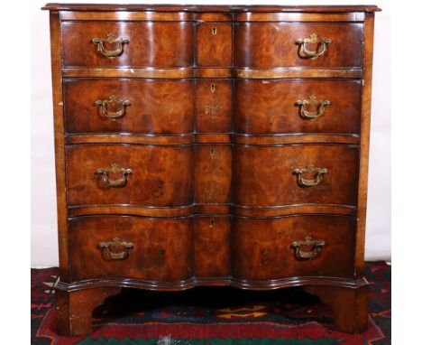 19th century Dutch style walnut chest of drawers with serpentine top above four long graduated drawers raised on bracket feet