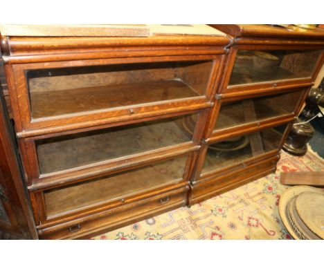 Near pair of triple section Globe Wernicke oak stacking bookcases, 86 x 108 x 110cm.