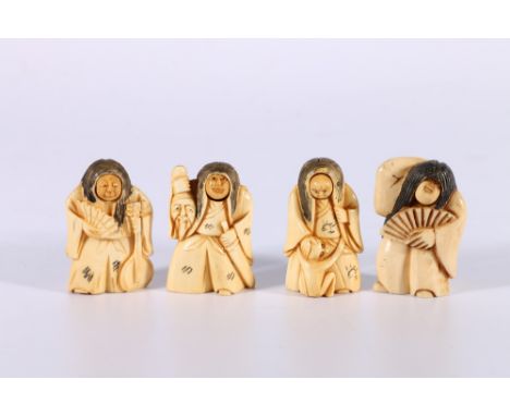 Four early 20th Century inked netsuke of dancing figures with rotating heads, 5cm. 