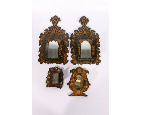 A pair of Iranian, early 20th century wooden mirror frames, lacquered and decorated with figures and flowers, window opening 