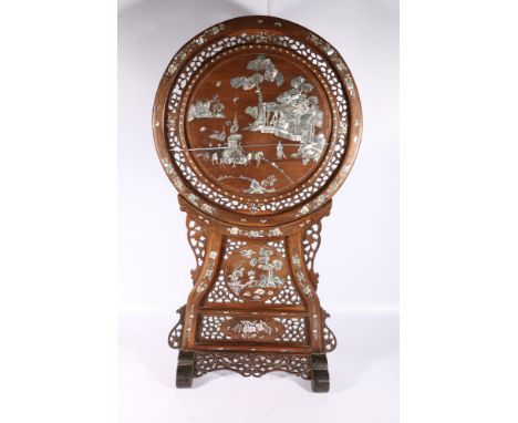 Chinese late 19th Century abalone inlaid screen and stand, the pierced and carved circular screen decorated with figures and 