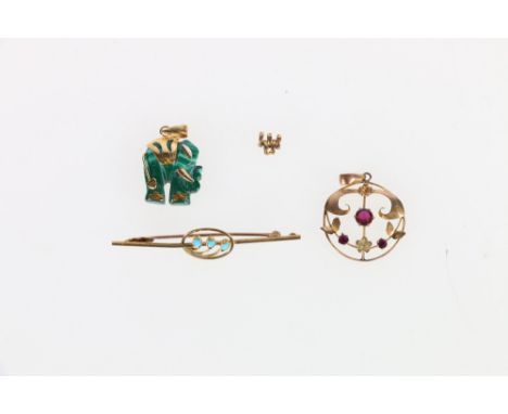 9ct gold ruby pendant 1.2g, a 15ct gold turquoise set bar brooch 1.67g and a gold mounted malachite elephant pendant 3.34g 