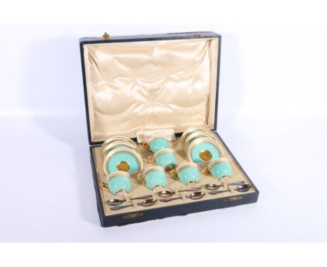 Royal Worcester six place gilt porcelain coffee set pattern number 719, and six silver coffee spoons by Henry James Hulbert L