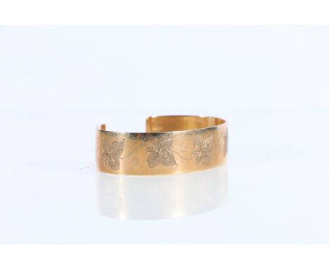 9ct gold bangle with engraved leaf design, makers CSG&amp;Co, Birmingham 32.8g gross 