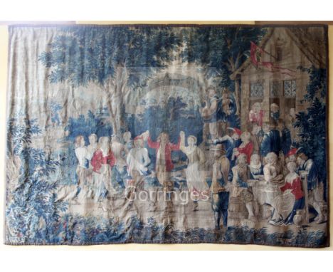 An early 18th century Flemish 'Teniers' tapestry, from the workshop of Guillaume Werniers, depicting four peasant couples dan