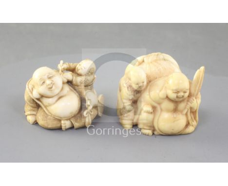Two Japanese ivory netsuke of Hotei and a boy, Meiji period, one in walrus ivory, unsigned, width 4.3cm, the other elephant i