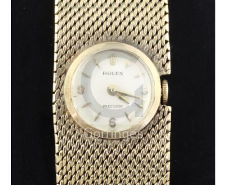 A lady's 9ct gold Rolex precision manual wind bracelet wrist watch, with baton numerals, overall length 18.7cm.