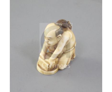 A Japanese ivory netsuke of the disappointed ratcatcher, 19th century, signed Tomomitsu, the crouching figure holding a box w
