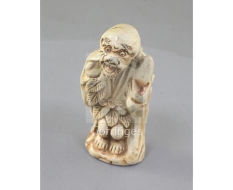 A Japanese porcelain netsuke a Sennin, 19th century, unsigned, 5.3cmProvenance: purchased from Bakers in November 1975.