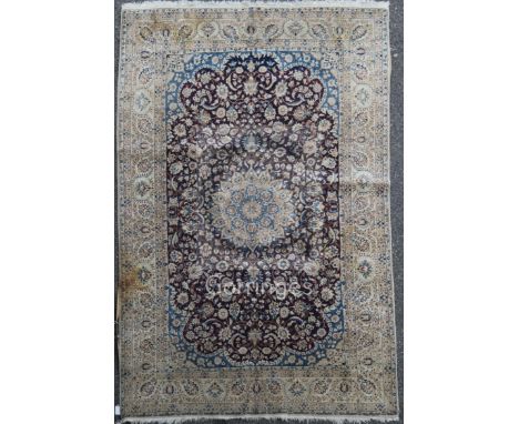 An Isfahan carpet, with field of scrolling foliage, on an ivory ground, 8ft 4in by 4ft 8in.