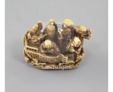 A Japanese ivory netsuke of the Takarabune (treasure ship) 19th century, signed Kagetashi, with the seven Gods of Happiness a