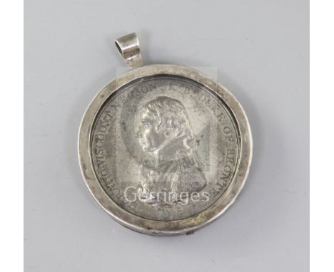 An early 19th century white metal Trafalgar medal by Matthew Boulton, struck with the portrait of Nelson on one side, the Nav
