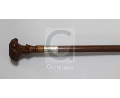 A late 19th century boxwood and mahogany cane, possibly a gift from the Prince of Wales, the finial carved as the Prince of W