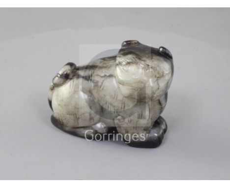 A Chinese pale grey and black jade figure of a seated cat, 18th/19th century, length 5.2cm