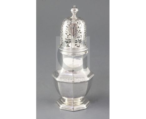 A large George I Britannia standard silver sugar caster by John Chartier, of octagonal form, with scroll pierced domed cover 