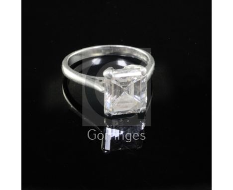 A modern platinum and emerald cut solitaire diamond ring, the stone weighing approximately 2.39cts, with an estimated colour 