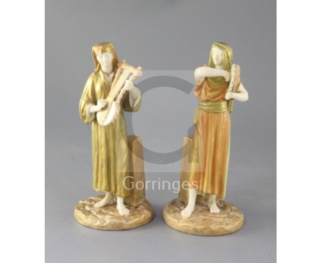 A pair of Royal Worcester Egyptian musicians by James Hadley, c.1891, model number 1084, height 22.5cm