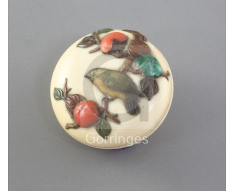 A Japanese shibayama and ivory manju netsuke, 19th century, decorated with a bird amid fruiting branches, three character sig