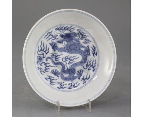 A Chinese blue and white 'dragon' saucer dish, 19th century, apocryphal Qianlong seal mark, 17.2cm