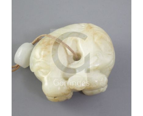 A Chinese pale celadon and russet jade figure of an elephant, 18th century, length 4.6cmProvenance: by family repute formerly
