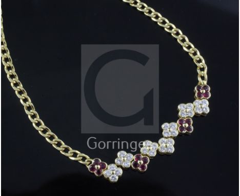 A Garrard & Co 18ct yellow gold curb-link necklace with seven diamond and four ruby conjoined four-stone 'flowerhead' cluster