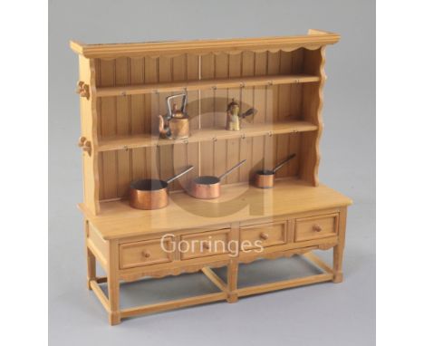 Denis Hillman. A mid 18th century style beech miniature dresser, with a pegged, shelved boarded rack over four small drawers 