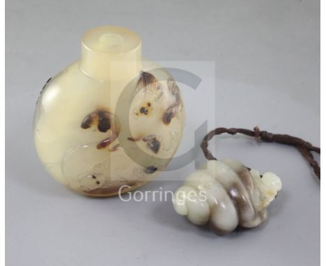 A Chinese pale celadon and brown jade carving and a shadow agate snuff bottle, late 19th/early 20th century, the jade carved 